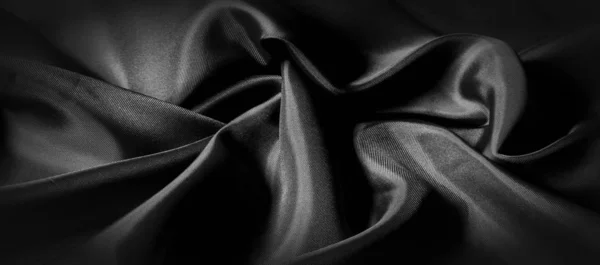 Textuur, achtergrond, patroon. Zwarte zijde stof. Het is zwart en — Stockfoto