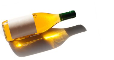 Bottle of light wine, white label, lies on white background. Pla clipart