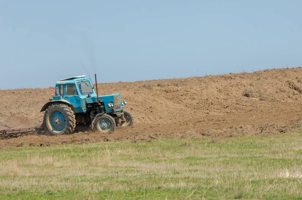 agricultural work in processing, cultivation of land in Kazakhstan. Ploughing heavy tractor during cultivation agriculture works at field with plough