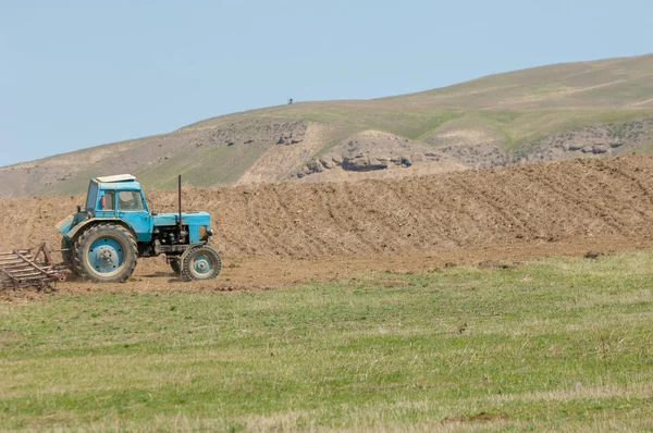 agricultural work in processing, cultivation of land in Kazakhstan. Ploughing heavy tractor during cultivation agriculture works at field with plough