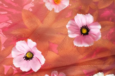 Pembe kumaş çiçek işlemeli. doku