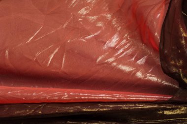 Pembe kahverengi şeffaf kumaş. doku. bornoz.