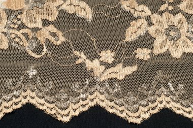 Doku. Stud oyununda yapılan dantel kumaş altın sarı renkli fotoğraflar