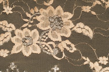 Doku. Stud oyununda yapılan dantel kumaş altın sarı renkli fotoğraflar