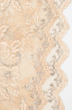 Doku. Stud oyununda yapılan dantel kumaş altın sarı renkli fotoğraflar