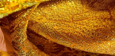 Doku arka planı, desen. Kumaş, sarı altın işlemeli kumaş. Organza brokar kumaş. Çoban, gevrek palmiyeli. Geniş iplik boyalı bir çiçek deseni var..