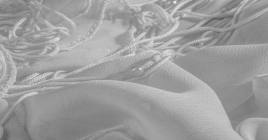 Arka plan, desen, doku, duvar kağıdı, beyaz ipek kumaş parlak bir parlaklık vardır. Bu en çok yönlü kumaştır. Tasarımınızın güzel vurgularıyla yaratıcı olun.