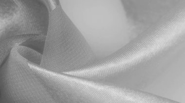 Doku, arkaplan, metalik parıltılı beyaz ipek çizgili kumaş. Eğer kötü bir ruh halin varsa, bu kumaş onu eşi görülmemiş yüksekliklere taşıyacaktır. Projeniz başarılı olacak..