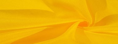 Doku arka plan deseni, sarı kumaş ipek. Krep saten arka tasarım için mükemmel bir kumaş, bir yandan bir saten bitirmek ve diğer - krep, hangi geri dönüşümlü hale getirir