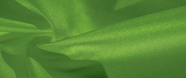 Doku, arka plan, desen, ipek yeşil kumaş. Krep saten arka tasarım için mükemmel bir kumaş, bir yandan bir saten bitirmek vardır, ve diğer - krep, hangi geri dönüşümlü hale getirir,