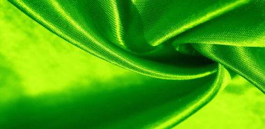 Doku, arkaplan, desen, yeşil renkli ipek kumaş. Bu sevimli, yumuşak ve parlak kumaşın pürüzsüz bir vizon yüzeyi var. Projelerinizi yaratmak için mükemmel..