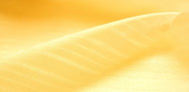 doku arka plan, model. İpek sarısı kumaş. Telio 'dan, bu organzanın ipek gazlı bezden daha ince ve keskin bir dokuması var. Bu lüks kumaşı her şey için kullan. Olasılıklar gerçekten sonsuz.!