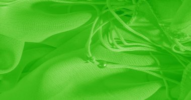Arka plan, desen, doku, duvar kağıdı, yeşil soluk ipek kumaş parlak bir ışıltıya sahip. Bu çok yönlü bir kumaş. Tasarımının güzel aksanlarıyla yaratıcı ol..