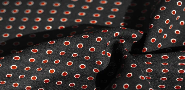 Texture background, pattern,  black silk fabric with red polka dots. Light and silky-soft satin charm is ideal for your design, Internet projects. It is also perfect for screensavers and wallpapers.