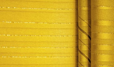 Tasarım arka plan dokusu, sarı kehribar rengi kumaş. Taze ve rahat bir stil için mükemmel..