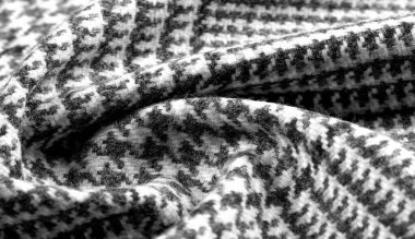 Arka plan dokusu, desen. Kumaş kalın, kareli bir desenle sıcak, gri siyah. Bu kumaşımla unutulmaz bir karşılaşma. En iyi tasarım çözümleri sizi bekliyor..