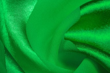 Doku, arkaplan, metalik parıltılı yeşil ipek çizgili kumaş. Eğer kötü bir ruh halin varsa, bu kumaş onu eşi görülmemiş yüksekliklere taşıyacaktır. Projeniz başarılı olacak..