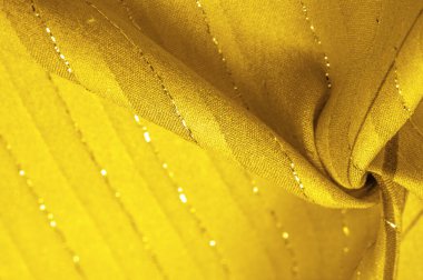 Tasarım arka plan dokusu, sarı kehribar rengi kumaş. Taze ve rahat bir stil için mükemmel..