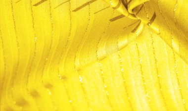 Tasarım arka plan dokusu, sarı kehribar rengi kumaş. Taze ve rahat bir stil için mükemmel..