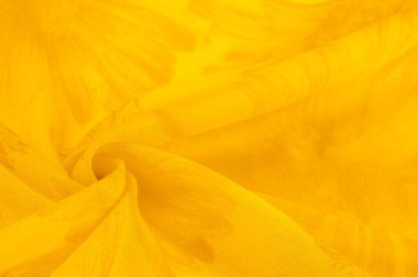 Arkaplan dokusu, sarı ipek kumaş boyalı çayır çiçekleri, spektrumda yeşil ve turuncu arasında renkler, ana çıkarıcı renk, olgun limon ya da yumurta sarısı gibi boyanmış..