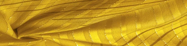 Design background texture, yellow amber fabric with lurex stripes, perfect for a fresh and comfortable style.