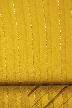 Tasarım arka plan dokusu, sarı kehribar rengi kumaş. Taze ve rahat bir stil için mükemmel..