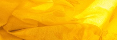 Arkaplan dokusu, sarı ipek kumaş boyalı çayır çiçekleri, spektrumda yeşil ve turuncu arasında renkler, ana çıkarıcı renk, olgun limon ya da yumurta sarısı gibi boyanmış..