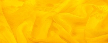 Arkaplan dokusu, sarı ipek kumaş boyalı çayır çiçekleri, spektrumda yeşil ve turuncu arasında renkler, ana çıkarıcı renk, olgun limon ya da yumurta sarısı gibi boyanmış..