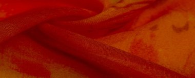 Arkaplan dokusu, boyalı çayır çiçekleri olan turuncu ipek kumaş.