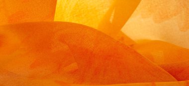 Arkaplan dokusu, boyalı çayır çiçekleri olan turuncu ipek kumaş.