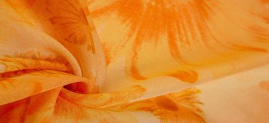 Arkaplan dokusu, boyalı çayır çiçekleri olan turuncu ipek kumaş.