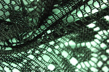 Doku, arkaplan, tasarım, yeşil kadın dantelinden şal, yeşil dantelden örgü, püskül, el örgüsü. Çiçek festivali. Tasarımınız, düğün üçgeniniz, gelinin tebrik kartı..