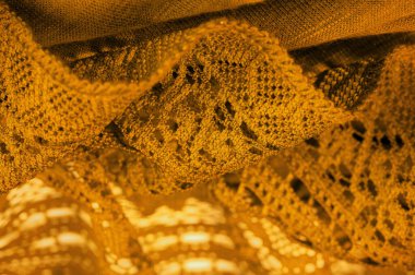 Arkaplan, doku, desen, sarı dantel kumaş, ince açık kumaş, genellikle pamuktan ya da ipekten yapılmış, halkalar, kıvrımlar ya da örgü iplikleriyle örülmüş.