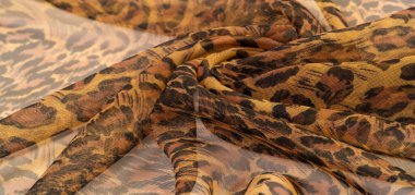 doku, ipek kumaş, leopar derisi, kahverengi-sarı siyah tonlar, sıcak Afrika safarisi,