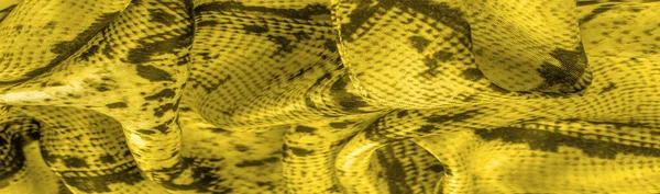 Background, texture, pattern, yellow fabric with a pattern of yellow squares, lines,