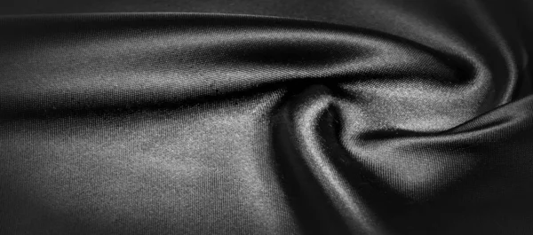 テクスチャ パターン 黒いシルク生地 黒で耐熱性のあるグレーです どんなイベントでも その堅いドレープをデザインに変換します サクサクした軽やかな手です — ストック写真