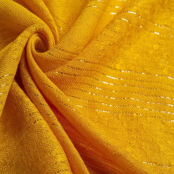 Texture, background, pattern, yellow gold fabric with glitter inserted, yellow strip of golden krypton stripes, designer fabric