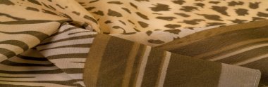 Dokusal arkaplan koleksiyonu, ipek kumaş, Afrika teması, hayvan derisi, kahverengi tonlar.