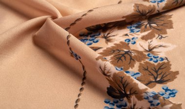 Doku, arka plan, şekil, Crepe de Chin. Bej rengi, mavi çiçekler. Bu bir ipek grubu, pürüzle karakterize edilmiş, aynı zamanda hafif kırışık..