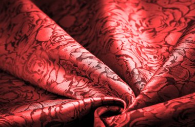 relief pattern, composite textiles, red silk fabric, with a floral pattern, unusually pleasant visual sensations: slippery, coolness, softness; beautiful appearance, unique luster;