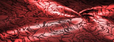 relief pattern, composite textiles, red silk fabric, with a floral pattern, unusually pleasant visual sensations: slippery, coolness, softness; beautiful appearance, unique luster;