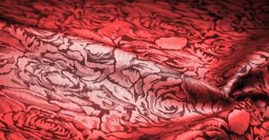 relief pattern, composite textiles, red silk fabric, with a floral pattern, unusually pleasant visual sensations: slippery, coolness, softness; beautiful appearance, unique luster;