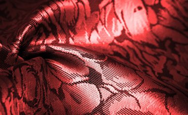 relief pattern, composite textiles, red silk fabric, with a floral pattern, unusually pleasant visual sensations: slippery, coolness, softness; beautiful appearance, unique luster;