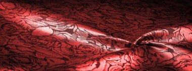 relief pattern, composite textiles, red silk fabric, with a floral pattern, unusually pleasant visual sensations: slippery, coolness, softness; beautiful appearance, unique luster;