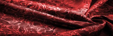 relief pattern, composite textiles, red silk fabric, with a floral pattern, unusually pleasant visual sensations: slippery, coolness, softness; beautiful appearance, unique luster;