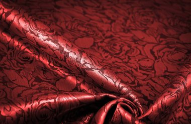 relief pattern, composite textiles, red silk fabric, with a floral pattern, unusually pleasant visual sensations: slippery, coolness, softness; beautiful appearance, unique luster;