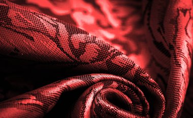 relief pattern, composite textiles, red silk fabric, with a floral pattern, unusually pleasant visual sensations: slippery, coolness, softness; beautiful appearance, unique luster;