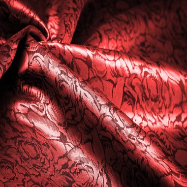 relief pattern, composite textiles, red silk fabric, with a floral pattern, unusually pleasant visual sensations: slippery, coolness, softness; beautiful appearance, unique luster;