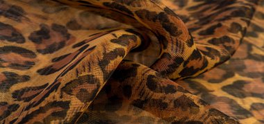 doku, ipek kumaş, leopar derisi, kahverengi-sarı siyah tonlar, sıcak Afrika safarisi,