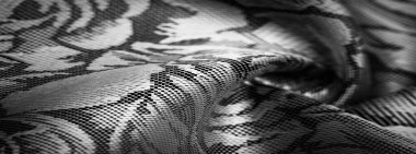 kabartma deseni, kompozit tekstil, siyah beyaz ipek kumaş, çiçek desenli, alışılmadık hoş görsel duyular: kayganlık, serinlik, yumuşaklık; güzel görünüş, eşsiz parlaklık
